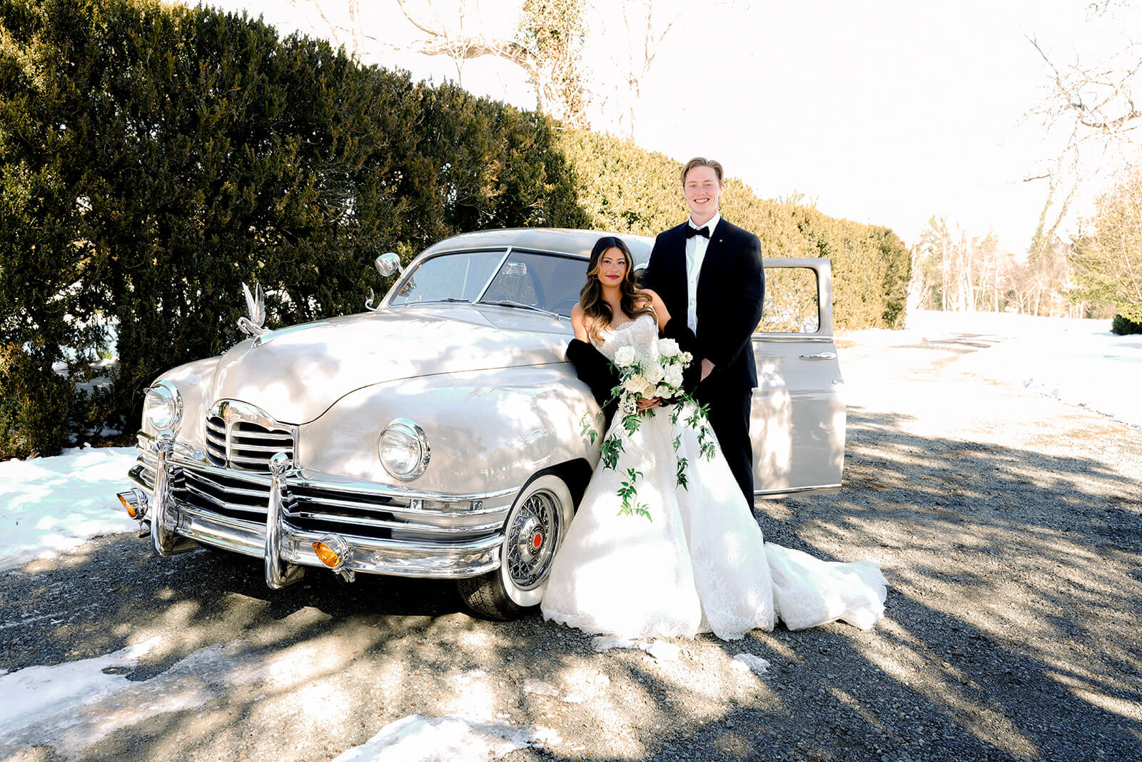 Bride and groom with 1949 Packard vintage wedding car — Classic Car Limousines Virginia